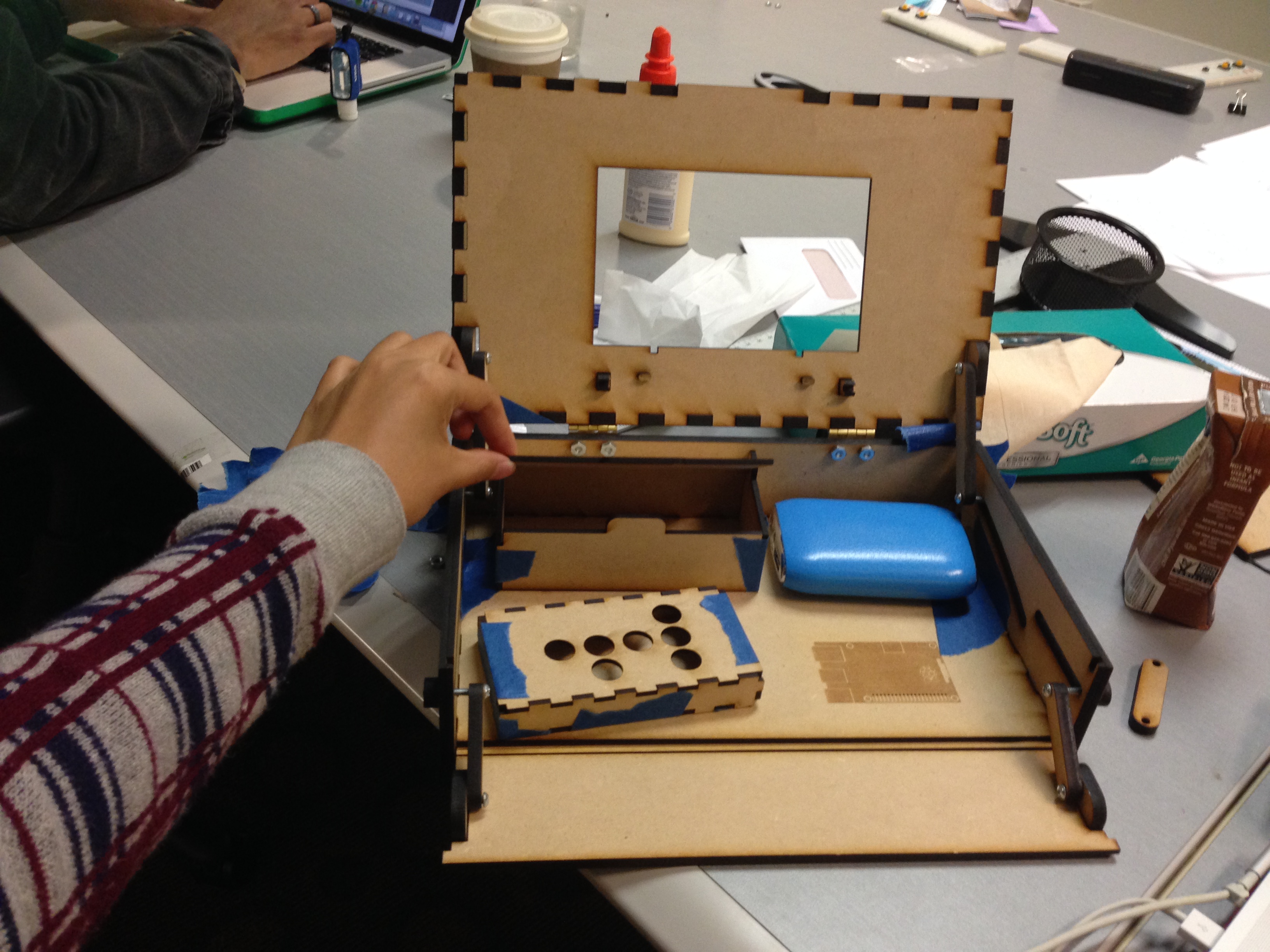Assembling a Piper prototype at a desk