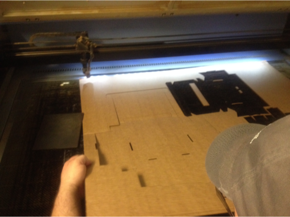 Cutting a cardboard V1 prototype to test proportions